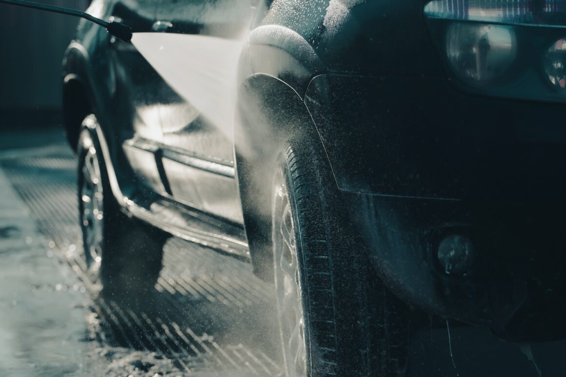 Dirty offroad car in a car wash